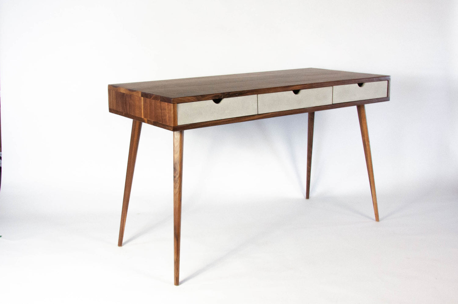 Black walnut office desk with three concrete drawers